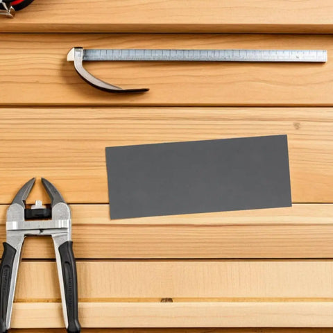 Premium 21 Piece Grit Wet Dry Sanding Paper Sheets Perfect For Metal Auto Bodywork Wood Furniture Projects Ultra Fine Finish And Amazing Smoothness laid on wooden surface with tools.