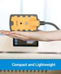 Person holding Beefy Heavy Duty 6 Outlet Power Strip With 25Ft Extension Cord, compact and lightweight design.