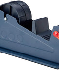 The Real Deal Heavy Steel Desktop Tape Dispenser Handles Up To Two Inch Packing Rolls With Three Inch Core And Delivers Smooth One Handed Cutting Plus Super Grippy Non Slip Workstation Base, showing a side view of the dispenser.