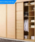 Wooden closet with sliding doors, showcasing organized shelves and hanging clothes, suitable for Stainless Steel Door Magnet Cabinet Catch.