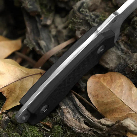 Close-up of EDC Fixed Blade Knife With Kydex Sheath 7 Inch D2 Steel Razor Sharp resting on leaves