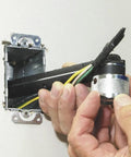 Conduit Locknut Wrench For One Half Inch And Three Quarter Inch Connectors With Direct Drive Heads in use with electrical wires
