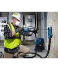 Bosch HCK001 7pc SDS-Plus Bulldog rotary hammer bit set; side view of worker drilling into concrete.
