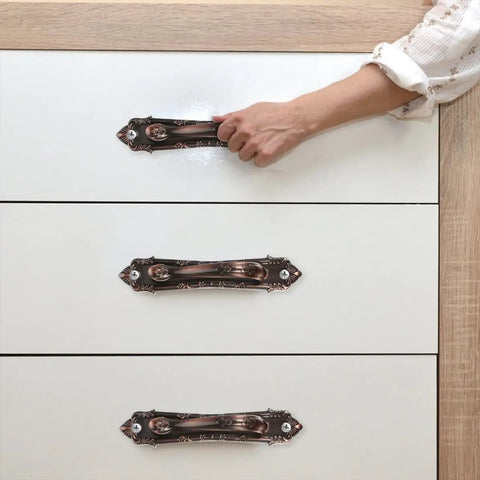 Vintage Zinc Alloy Door and Wardrobe Pull Handles Set in Coffee Brown on white cabinet, ergonomic safe and classy hardware.
