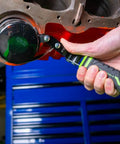 Swivel Oil Filter Wrench For 4-3/4 To 5-3/4 Inch Filters being used on engine with green padded TPR handle