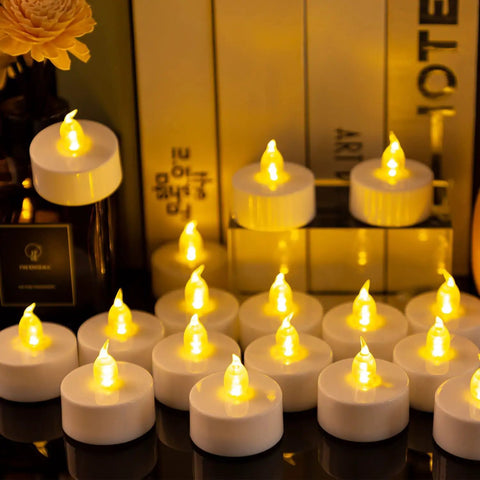100 Pack Flameless LED Tea Lights Candles With Realistic Flicker And About 200 Hours Battery Life arranged on a tabletop
