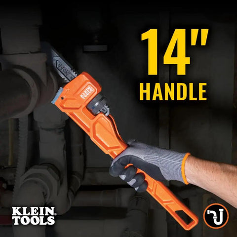 14 Inch Cast Iron Pipe Wrench Heavy Duty Adjustable Plumbing Wrench With I Beam Handle gripping a pipe in a dark space.