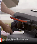 Close-up of locking lid and foldable legs on one burner portable gas grill with stainless steel burner, compact for outdoor use