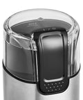 Top view of Fast Electric Coffee Grinder For Home Use Easy To Use Coffee Bean And Spice Grinder with clear lid and stainless steel blades.