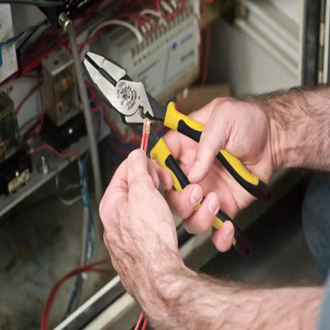 Journeyman Pliers With Crimp Die Behind Hinge For Superior High Leverage Crimping, demonstrating use on electrical wiring