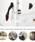 Baby Safety Locks For Cabinets And Drawers Adhesive with flexible belt connecting cabinet doors, durable ABS and nylon material.
