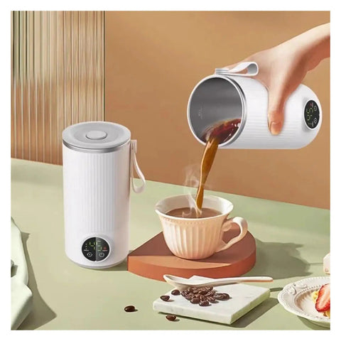 Grab And Go Heated Self Stirring Mug Electric Magnetic Mixing Travel Cup pouring hot coffee into a cup on a table.