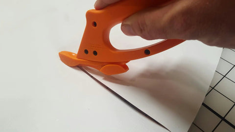 Totally Rock Solid Bi Directional Safety Knife With Slick Retractable Blade And Ergonomic Handle For No Sweat Vinyl Wrapping Banner Cutting And Print Shop Tasks, cutting through vinyl.