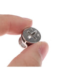 Close-up of single piece from 10 Pcs Thickening Three In One Connector Eccentric Wheel Hardware For Furniture And Cabinets Zinc Alloy Cam Nut Diameters 15mm 12mm And 10mm Durable Construction Compact Storage In Transparent Box in hand, showing metal texture.