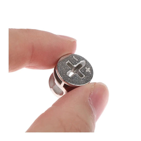 Close-up of single piece from 10 Pcs Thickening Three In One Connector Eccentric Wheel Hardware For Furniture And Cabinets Zinc Alloy Cam Nut Diameters 15mm 12mm And 10mm Durable Construction Compact Storage In Transparent Box in hand, showing metal texture.