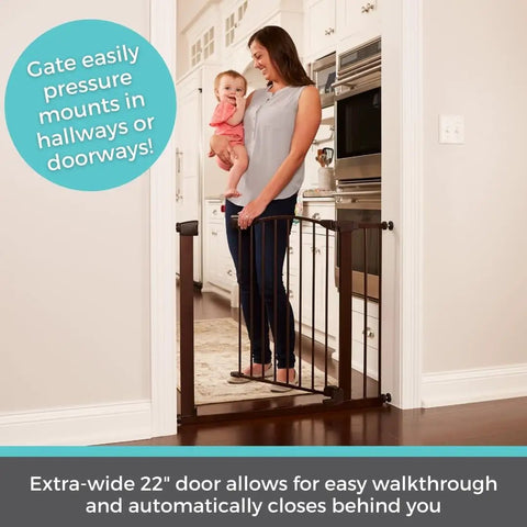 Stone Arch Auto Close Baby Gate For Doorways Bronze Metal Safety Gate, mom and baby standing behind tall gate at door.