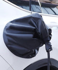 Grip Tight Magnetic EV Charger Cover For Cadillac Optiq 2025 To 2026 protects charging port with black waterproof fabric.