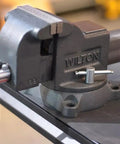 Heavy Duty 4 Inch Bench Vise With 360 Degree Swivel Base Double Lockdowns 4 Inch Jaw Width mounted on a workbench