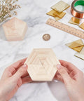 Hella Reliable Wood And Glass Soldering Jig Set Featuring Hexagon And Pentagon Molds For No Sweat Stained Glass Assembly and a hands holding a hexagon mold.