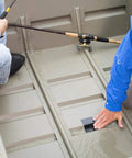 Person applying Mini Black Rubberized Waterproof Tape For Quick Seals And Patches on a boat to seal a leak.