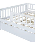 Full-Size Wood Daybed With Trundle And Fence Guardrails In White Finish showing detailed guardrail design and slatted frame