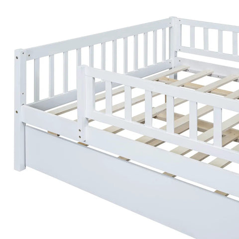 Full-Size Wood Daybed With Trundle And Fence Guardrails In White Finish showing detailed guardrail design and slatted frame