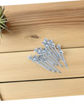 Heavy Duty Lawn Aerator Shoes With Metal Peg Spikes 12 Pair Durable Soil Loosening Tool on wooden surface.