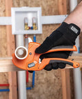 Man using Ratcheting PVC Pipe Cutter For One Handed Use That Cuts One And A Quarter Inch ID PVC CPVC And PEX Lightweight