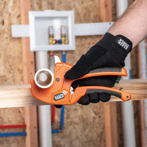 Man using Ratcheting PVC Pipe Cutter For One Handed Use That Cuts One And A Quarter Inch ID PVC CPVC And PEX Lightweight
