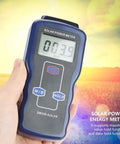Hand holding High Precision Solar Radiation Meter With Large LCD Display For Field Or Lab Use, Easy Sunlight Power Tester.