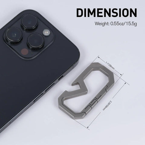 Badass Titanium Keychain Carabiner Multitool With Bottle Opener on white surface next to smartphone, 0.55oz, 58mm by 28mm dimensions.