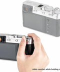 Deluxe Metal Thumb Up Grip For Fuji X100V X100F X-E4 X-E3 Cameras held in hand, demonstrating secure hold and comfortable handling.