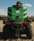 Vehicle Spreader With Adjustable Feed Rate And Universal Attachment For Trucks And Off Road Rigs, 125Lb Hopper in action on field