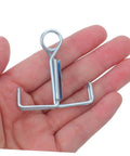 Hand holding a single Laboratory Adjustable Rubber Hose Clamp for Scientific Experiments and Industrial Plumbing, close-up view.