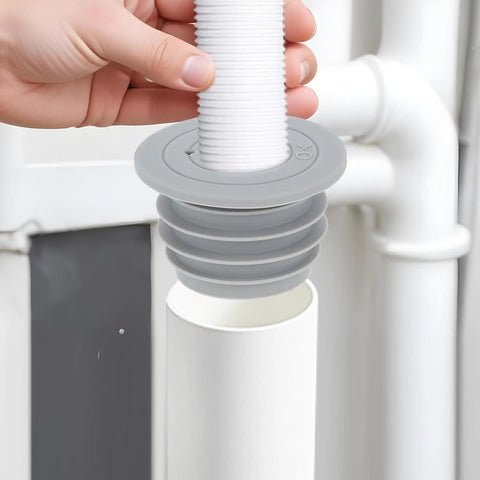 Two Pack Flexible Silicone Drain Plug For Washing Machines And Floor Drains shown in gray, being placed into a sink pipe for easy installation.