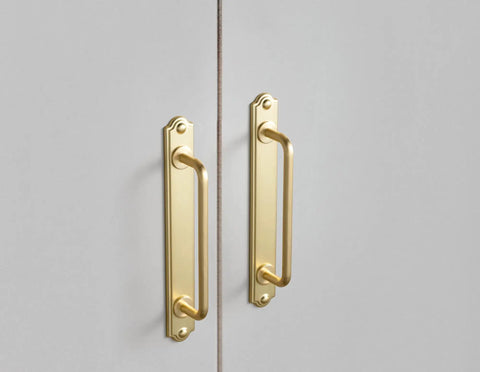 7.56 Inch Cabinet Handles In Brushed Brass mounted on gray cabinet doors with backplate and spacer, 2 pack bar cabinet pulls for dresser