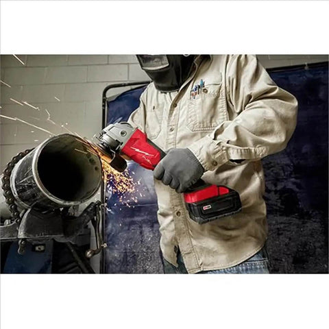 Badass Brushless Angle Grinder Set Featuring Dual High Output Batteries And Rapid Charger in use cutting metal pipe.