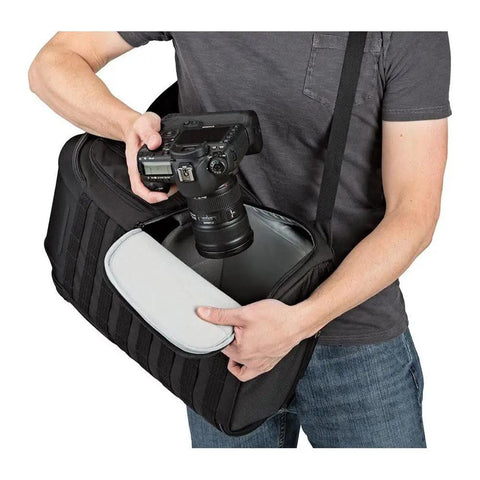 Person placing camera in ProTactic 450 AW II Camera Backpack With All Weather Cover, Built To Haul DSLR, Mirrorless, And Drone Gear