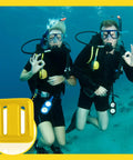 Scuba divers underwater with Four 2.2 Lb Rubber-Coated Dive Weights With Nylon Belt For Freediving, Spearfishing, And Scuba.