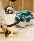 XCV11Z 18V LXT Brushless Cordless 2-Gallon HEPA Wet Dry Dust Extractor Vacuum in use on wood shop floor