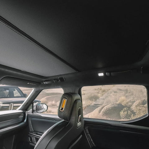 VION R1S roof sunshade, two-piece blackout interior shade installed over Rivian R1S panoramic roof.