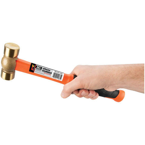 Hand holding Pro Grade Solid Brass Hammer 16 Oz No Spark No Magnetic For Delicate Metal Surfaces 11 Inch Handle High Visibility Shaft