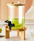 Heavy Duty Black Plastic Cooler Faucet And Reusable Spigot Tap With Leak Proof Seal For Water Buckets Party Coolers Beverage Dispenser on a glass drink dispenser.