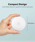 Smart Water Leak Detector 2 Pack With WiFi Alerts And 75 DB Alarm shown in hand for scale