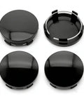 Set Of Four Matte Black Wheel Center Hub Caps Heavy Duty Abs Snap In Rim Covers Universal Fit showing shiny black design from top view.