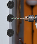Installation of Ten Pack Neodymium Cup Magnets 150 Lb Pull With Countersunk Hole on a wall using a drill.