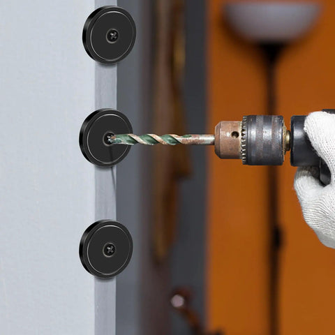 Installation of Ten Pack Neodymium Cup Magnets 150 Lb Pull With Countersunk Hole on a wall using a drill.