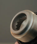 Close-up of 40mm stainless steel conical burrs in Dope Stepless Coffee Grinder for precise espresso grinding.