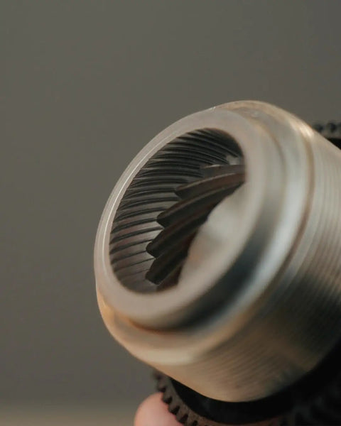 Close-up of 40mm stainless steel conical burrs in Dope Stepless Coffee Grinder for precise espresso grinding.