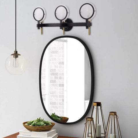 Three Light Vanity Light Fixture In Black Gold Finish With Seeded Glass Over Mirror Wall Sconces